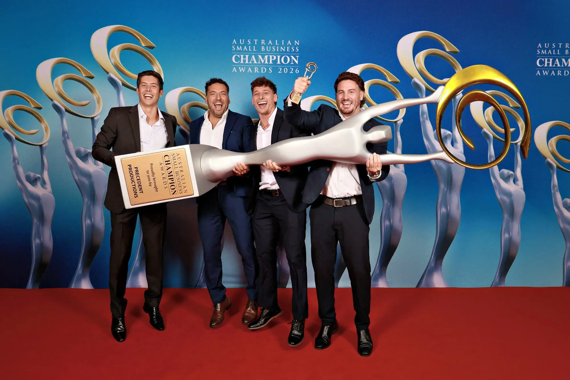 The Removal Brothers team together with the trophy at the 2026 Champion Awards