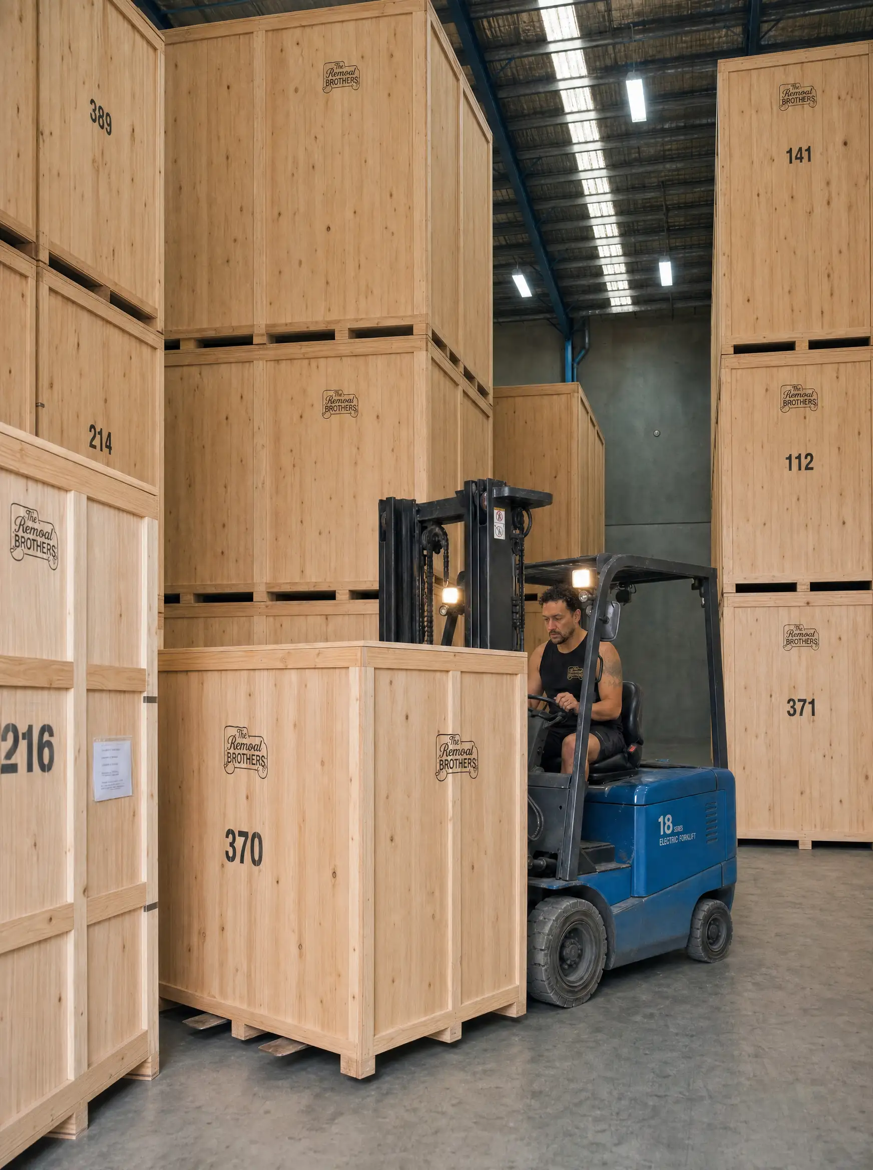 Individually numbered timber storage crates stacked in the Removal Brothers warehouse